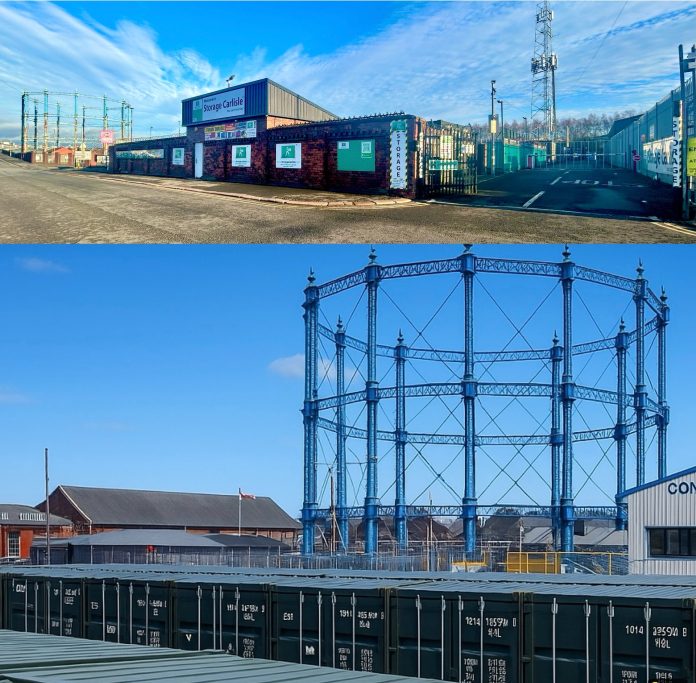 Urban landscape featuring industrial containers and a gas holder structure.