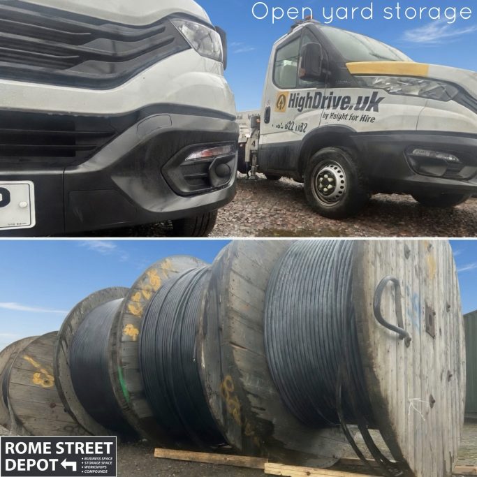 Close-up of a van beside large cable reels in open yard storage.